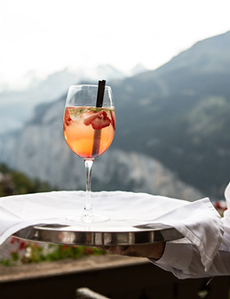 A Waiter Serving a Drink