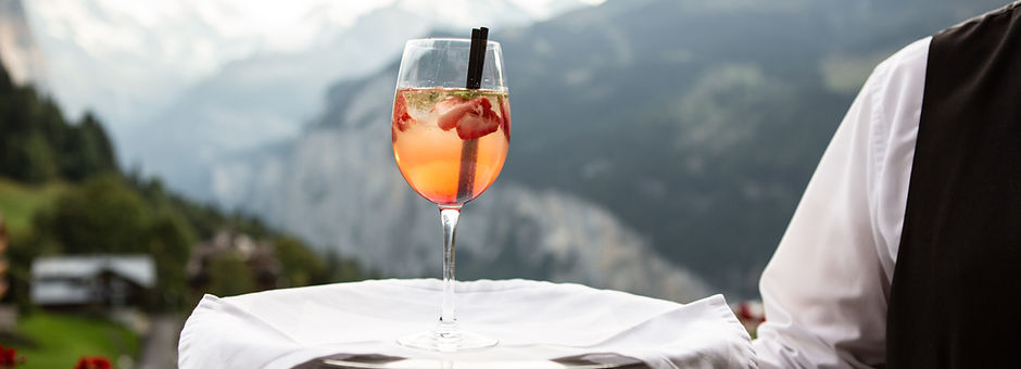 A Waiter Serving a Drink