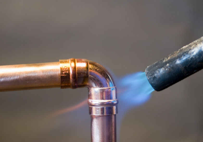 Hot blow torch soldering right angle elbow