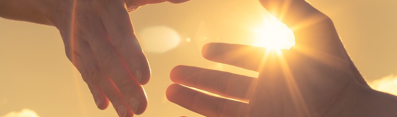 Hands Reaching in Sunlight