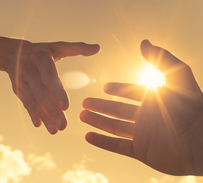Hands Reaching in Sunlight