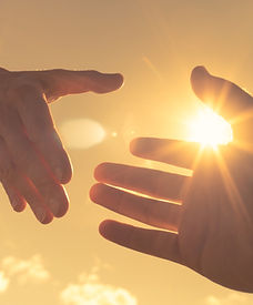 Hands Reaching in Sunlight