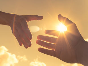 a hand reaching out for someone else.