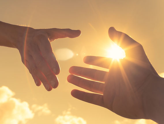 Hands Reaching in Sunlight