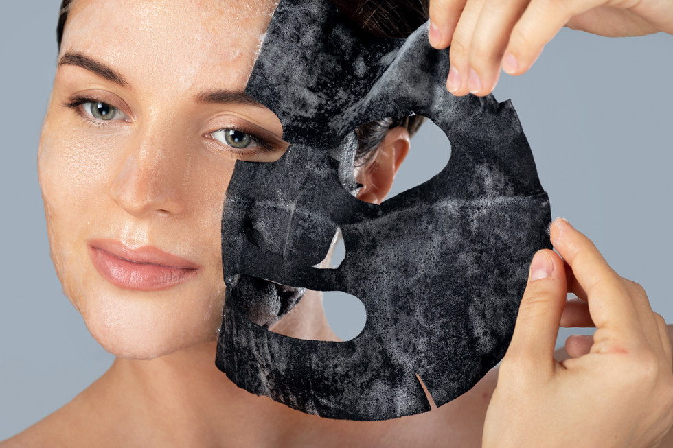 Woman removes a cleansing black face mask
