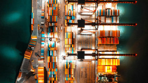 Global financial district at night symbolizing geopolitical recalibration and corporate risk