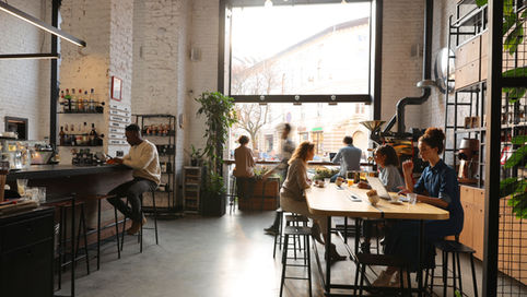 People enjoying coffee at a trendy cafe