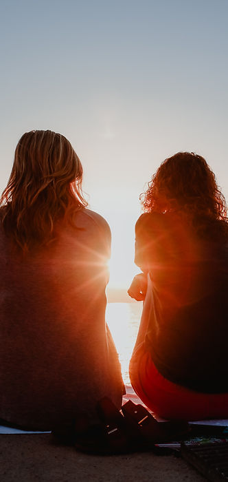 two women sitting at the beach at sunset, complex trauma journey, healing CPTSD, group for women with complex trauma