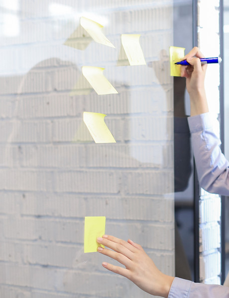 Writing on yellow post-it notes