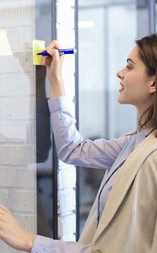 Writing on yellow post-it notes