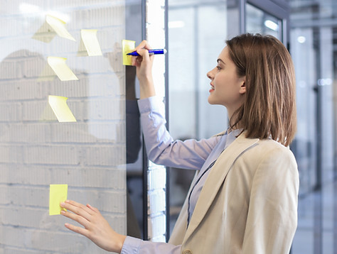 Writing on yellow post-it notes