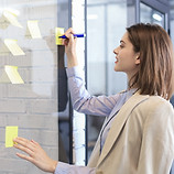 Writing on yellow post-it notes