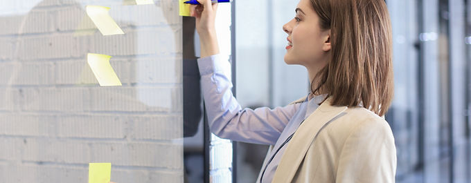 Writing on yellow post-it notes