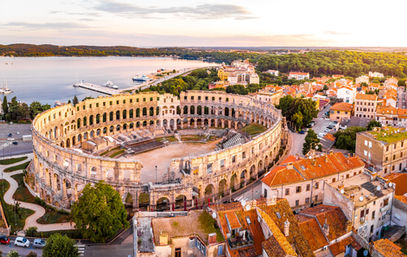 Private guided tour of the Pula Amphitheatre, a key stop on bespoke Balkan tours.