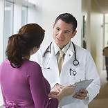 Patient talking with a doctor about their health insurance options