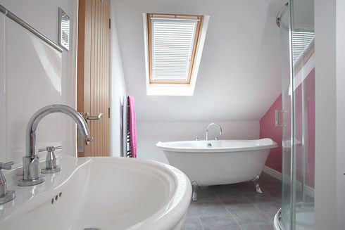 bathroom space with white tub and sink and shower cubicle