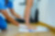 Podiatry specialist with latex gloves using special equipment to treat foot diseases
