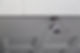 Security camera mounted on a ceiling, angled downward