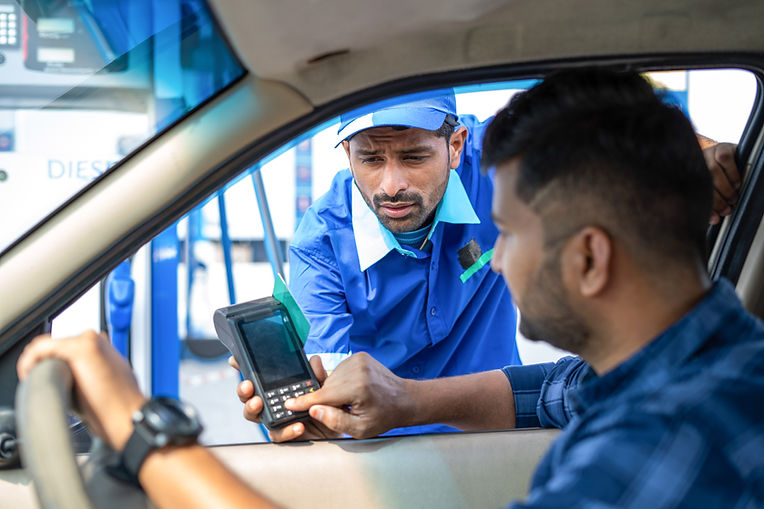 Customer Paying at a Gas Station