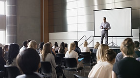 Professor Lecturing on Stage