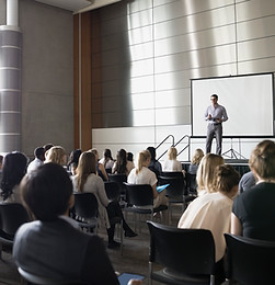 Professor Lecturing on Stage