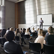Professor Lecturing on Stage