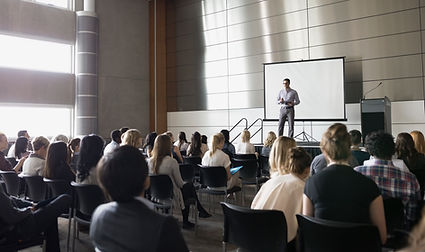 Professor Lecturing on Stage
