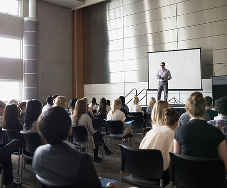 Professor Lecturing on Stage
