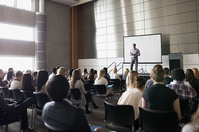 Professor Lecturing on Stage