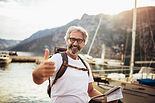 Man embracing retirement and new adventures with confidence after personal coaching.