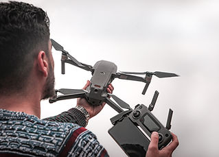 Man Preparing to Fly a Drone