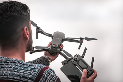 Man Preparing to Fly a Drone