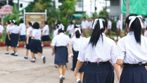 Male and female students outside school
