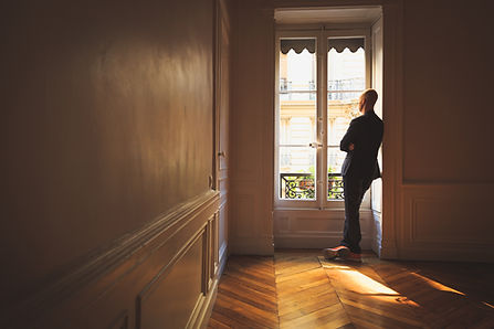 Man Looking Out the Window