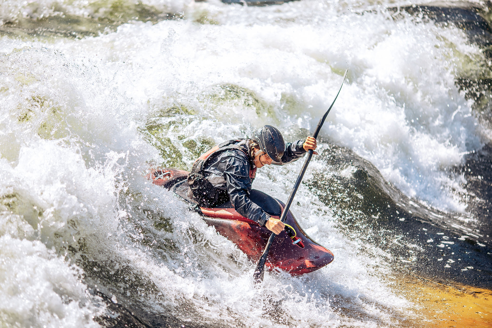 Canoeing in rapid waters.
