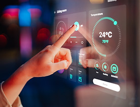 Hand using a smartphone app to control the smart heating system and home temperature