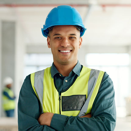 Construction worker in vest and helmet smiling