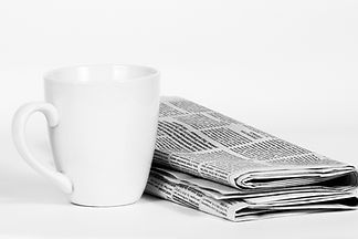 Cup And Newspaper