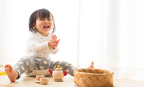 Toddler with Wooden Toys