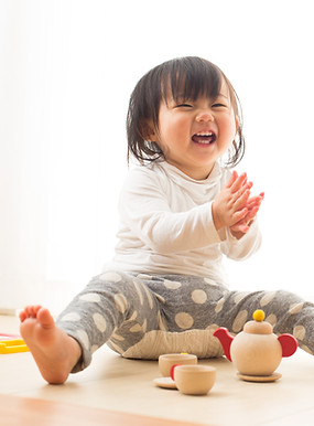 Toddler with Wooden Toys