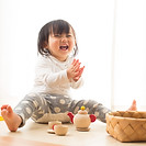 Toddler with Wooden Toys