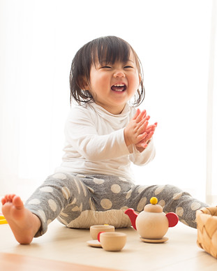 Toddler with Wooden Toys