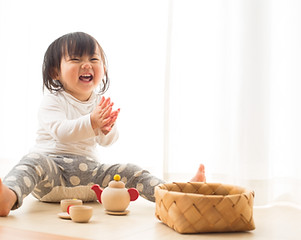 Toddler with Wooden Toys