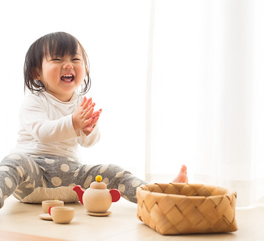 Toddler with Wooden Toys