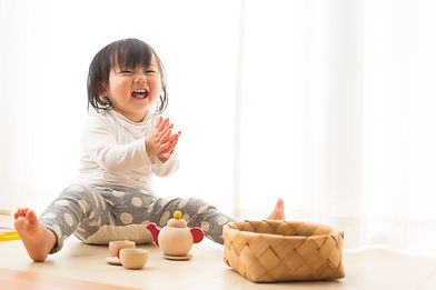 Toddler with Wooden Toys