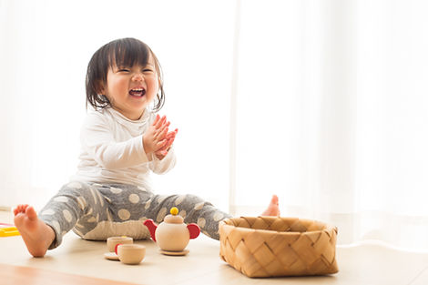 Toddler with Wooden Toys