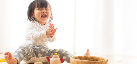 Toddler with Wooden Toys