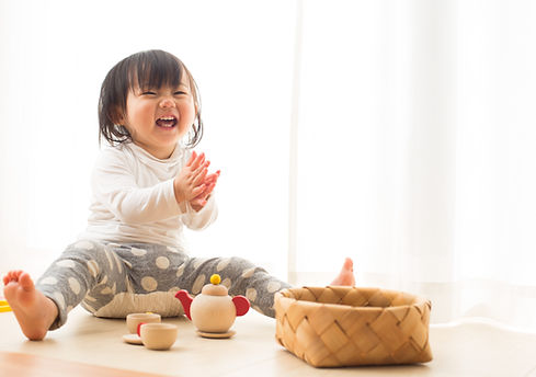 Toddler with Wooden Toys