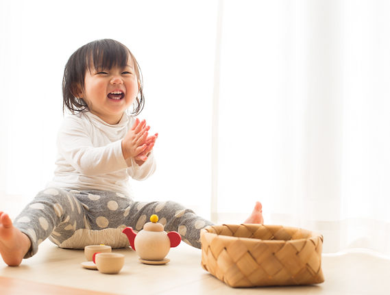 Toddler with Wooden Toys