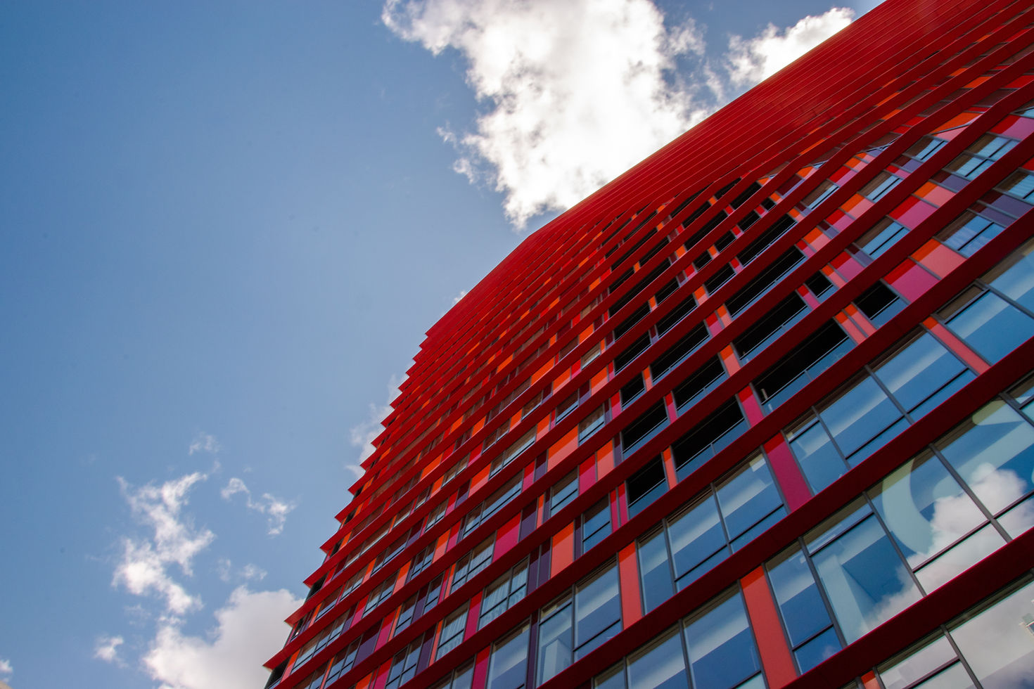 Red building illustrating a property portfolio managed with ticketing software